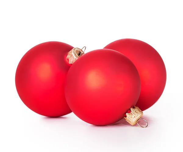 Drie rode kerstballen — Stockfoto