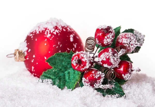 Christmas ball in the snow with rowan — Stock Photo, Image