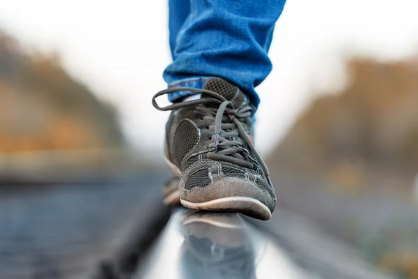 Railroad rails feet sneakers — Stock Photo, Image