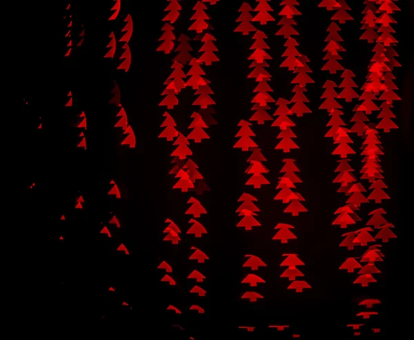 Kırmızı bokeh arka plan ışık köknar ağacı — Stok fotoğraf