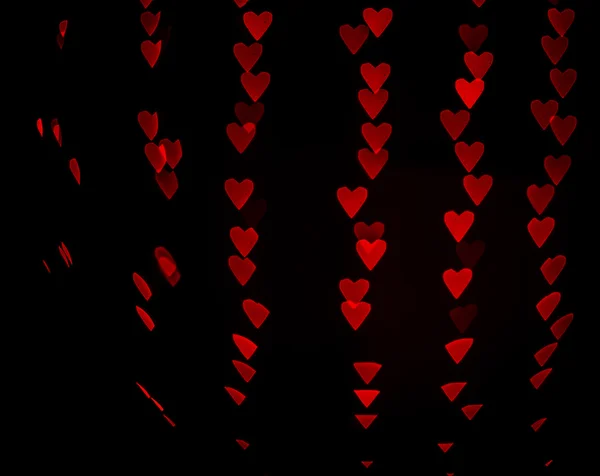 Rojo bokeh fondo corazón — Foto de Stock