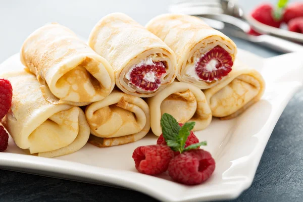 Crepes filled with cottage cheese and raspberry — Stock Photo, Image