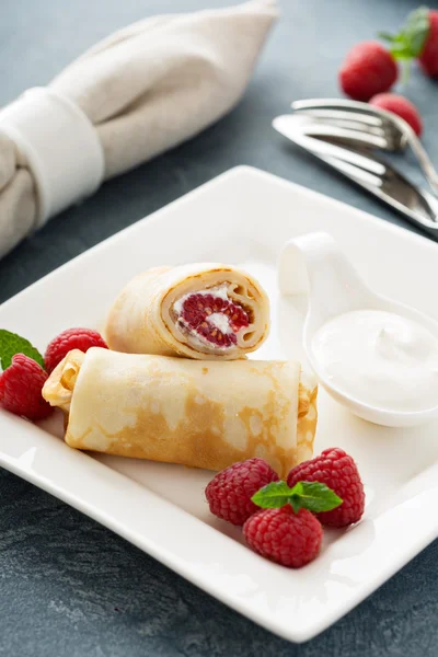 Crepes filled with cottage cheese and raspberry — Stock Photo, Image