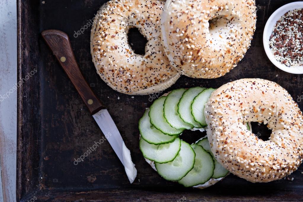 Everything bagels with cream cheese and cucumber Stock Photo by