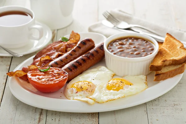 Full english breakfast with egg and bacon — Stock Photo, Image