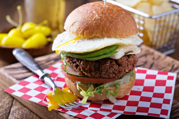 Vegetarian burger with egg and avocado