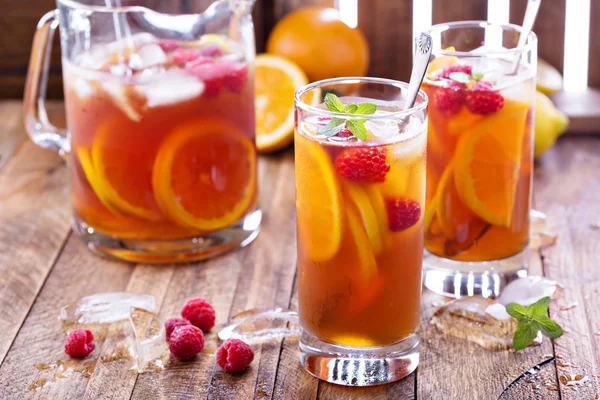 Iced tea with orange and raspberry