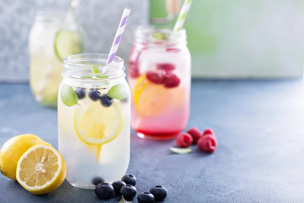 Variety of lemonade in jars — Stock Photo, Image