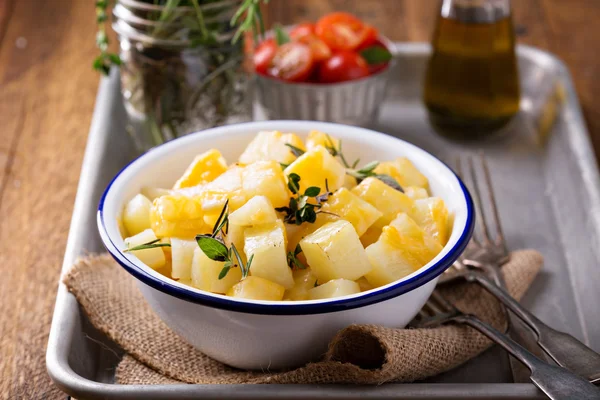 Potato with cheese and herbs prepared on a grill — Stock Photo, Image