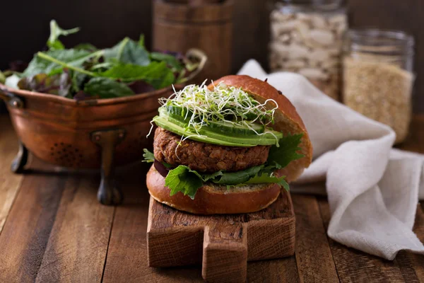 Grilled vegan bean burger with greens