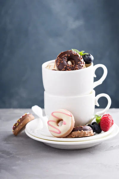 Little colorful donuts in white cup — Stock Photo, Image