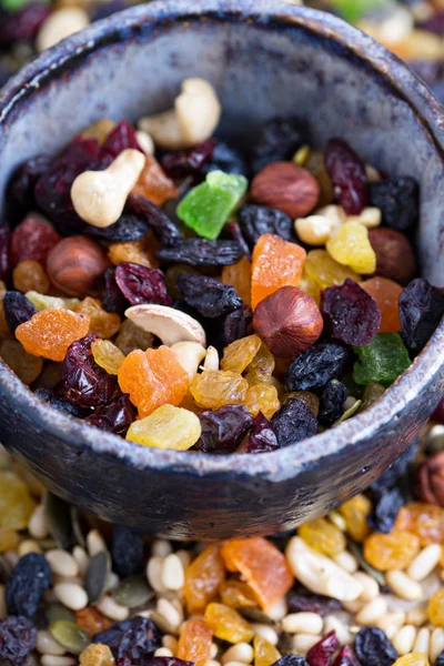 Mixed nuts and fruits in a bowl — Stock Photo, Image