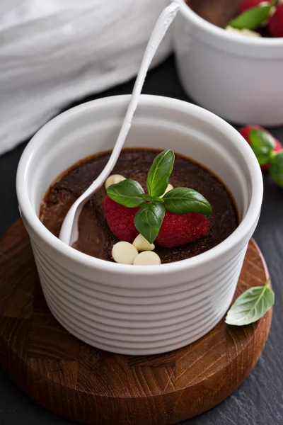 Chocolate pudding with raspberries and basil — Stock Photo, Image