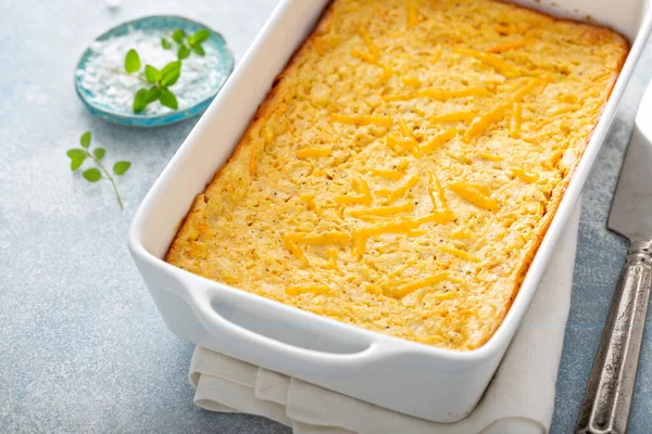 Cheesy cornbread freshly baked in a pan — Stock Photo, Image