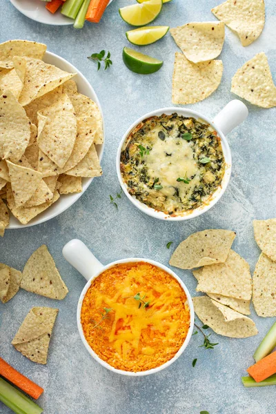Artichoke spinach and buffalo chicken dips with chips