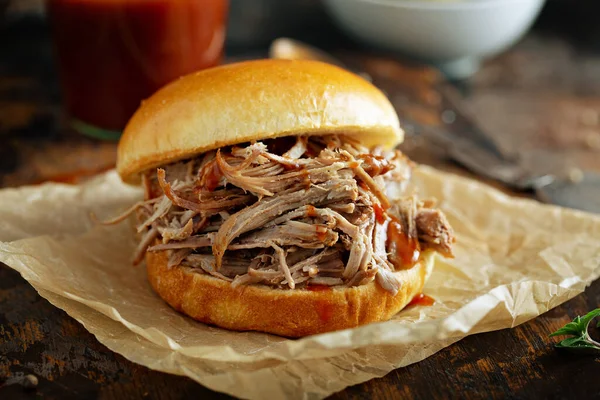 Pulled pork sandwich on a brioche bun