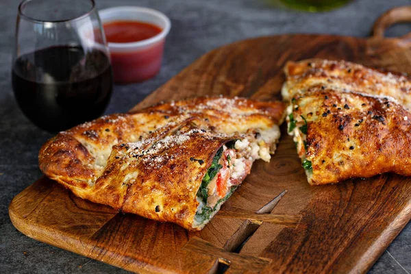 Traditional calzone cut in half — Stock Photo, Image
