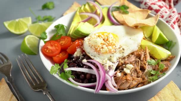Breakfast burrito bowl with pork carnitas and rice — Stock Video