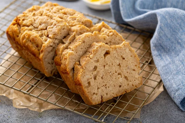 Beer bread on a cooling rack sliced and ready to eat — Stock Photo, Image