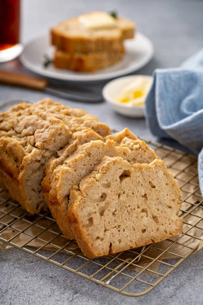 Beer bread on a cooling rack sliced and ready to eat — Stock Photo, Image