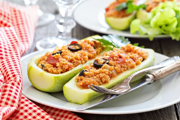 Stuffed squash with millet, tomatoes and olives Stock Image