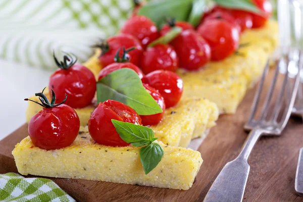 Polenta tart with baked tomatoes — Stock Photo, Image