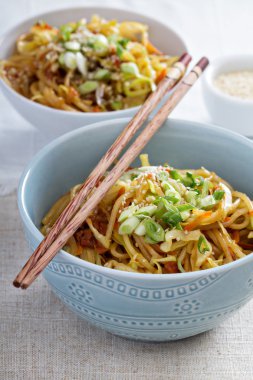 Stir fry with noodles, cabbage and carrot clipart