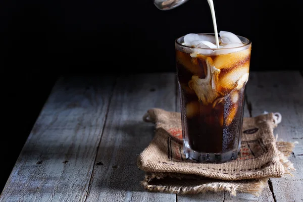 Iced coffee in a tall glass — Stock Photo, Image