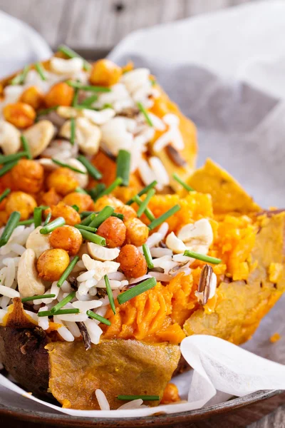 Baked stuffed sweet potato with rice — Stock Photo, Image