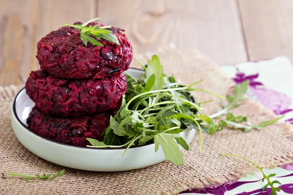 Beetroot vegan burgers with rice and beans