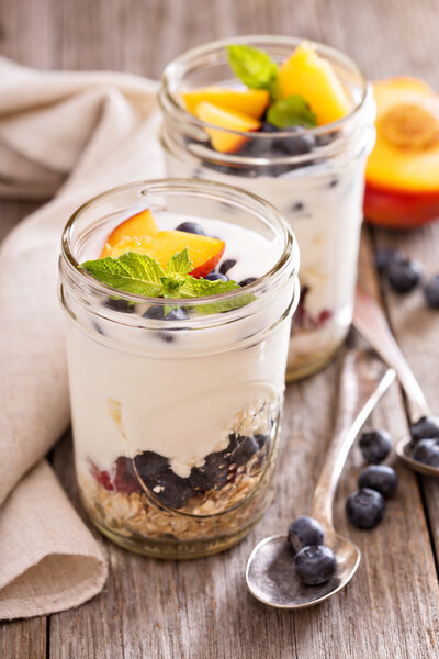 Layered breakfast parfait with granola and fruits