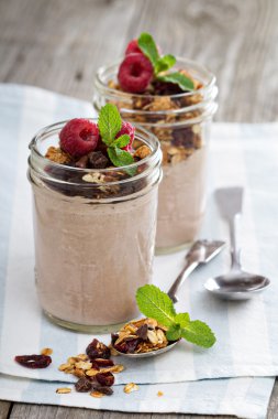 Chocolate smoothie with granola for breakfast clipart