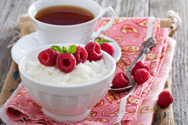 Rice pudding with raspberries — Stock Photo, Image