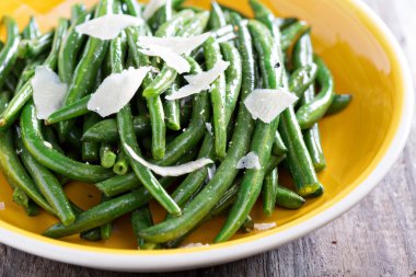 Sauteed green beans on big plate clipart