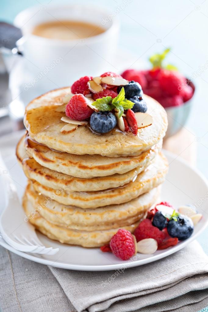 Fluffy oatmeal pancakes stack with fresh berries