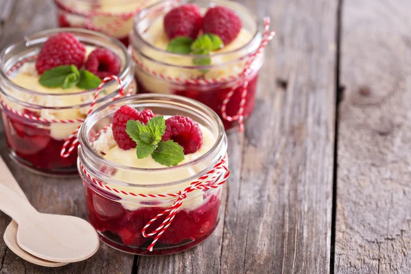 Colorful and delisious dessert in a jar berry cramble — Stock Photo, Image