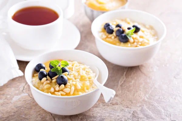 Cooked millet porridge with lemon curd and blueberry — Stock Photo, Image