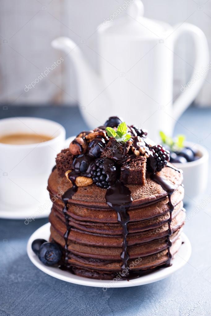 Stack of chocolate pancakes with toppings