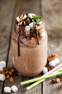 Chocolate shake with sauce and marshmallows clipart