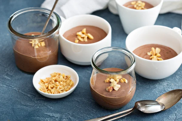Chocolate yogurt dessert with salted peanuts — Stock Photo, Image