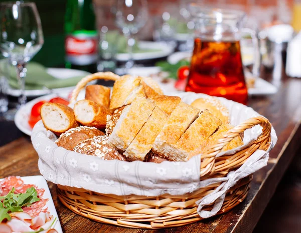 Bread in basket on the banquet table — Stock Photo, Image