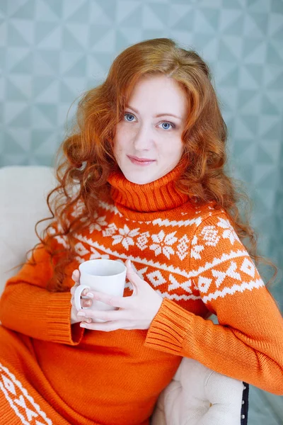 Cozy portrait of  woman in warm sweater on the bed with cup of t — Stock Photo, Image