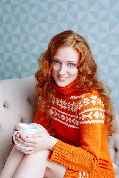 Cozy portrait of  woman in warm sweater on the bed with cup of t — Stock Photo, Image