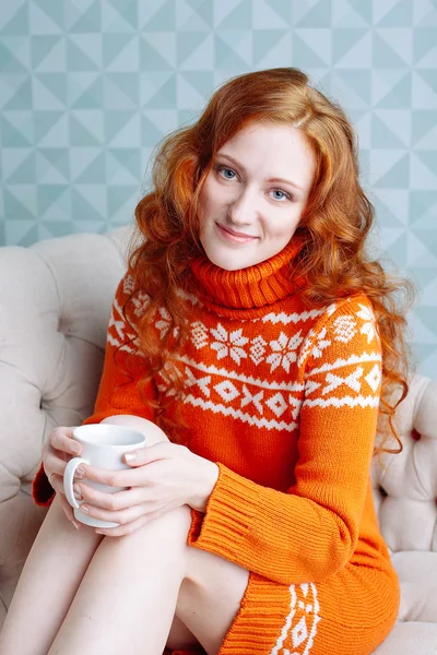 Cozy portrait of  woman in warm sweater on the bed with cup of t — Stock Photo, Image