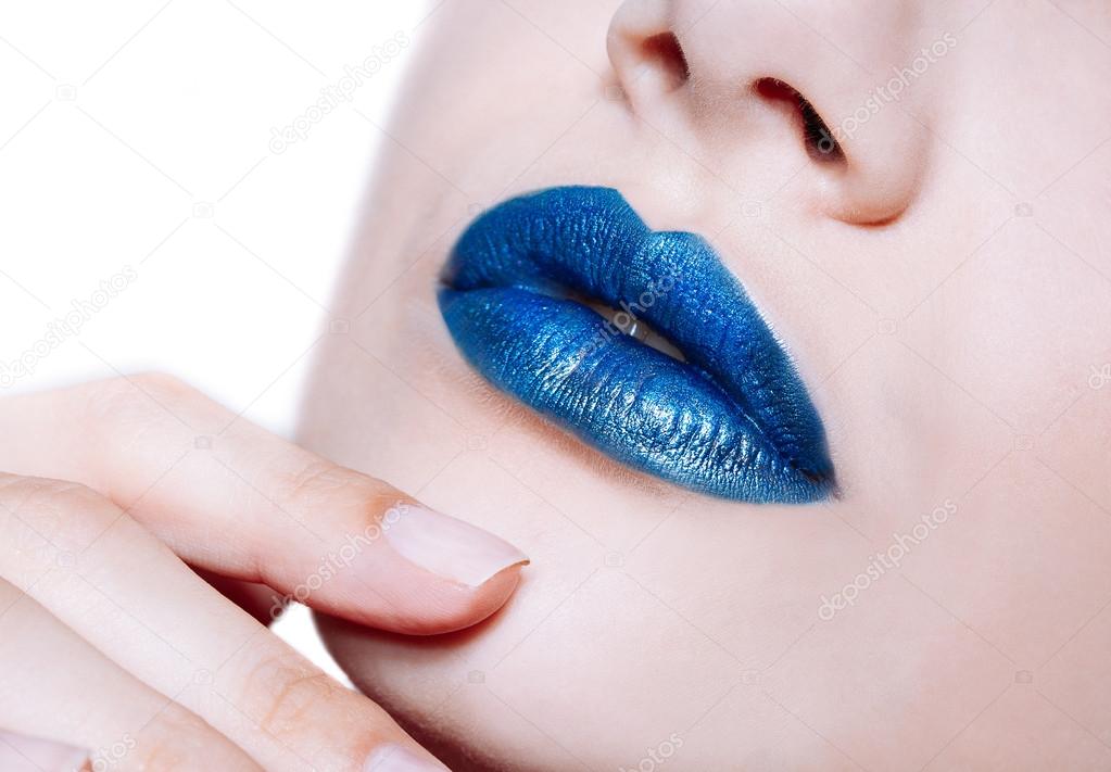 Woman lips with glossy blue lipstick