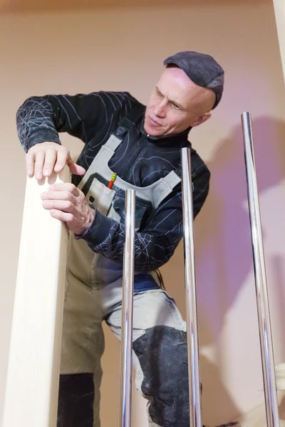 Carpenter Polishing Modern Ladder with Sandpaper — Stock Photo, Image