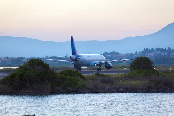 Airplane before take-off, evening scene, Corfu Royalty Free Stock Photos