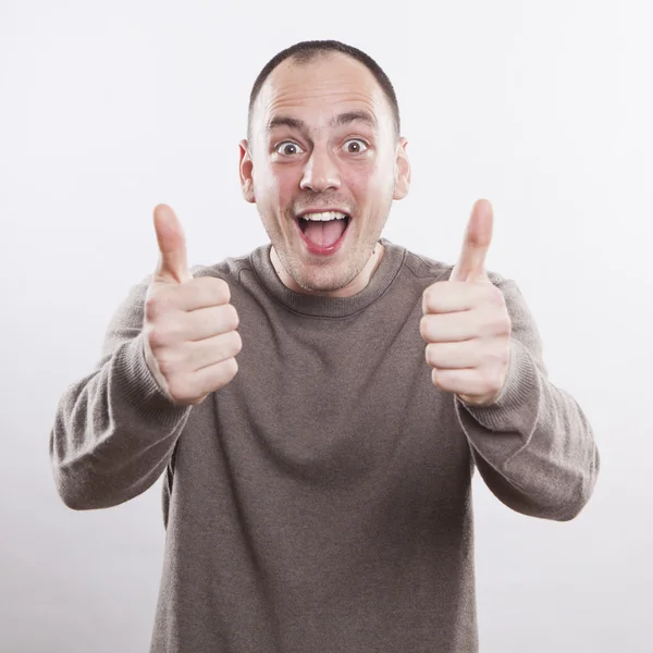 Portrait of a winner man with thumbs up — Stock Photo, Image