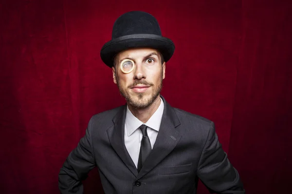 Jonge gentleman met een condoom monocle — Stockfoto