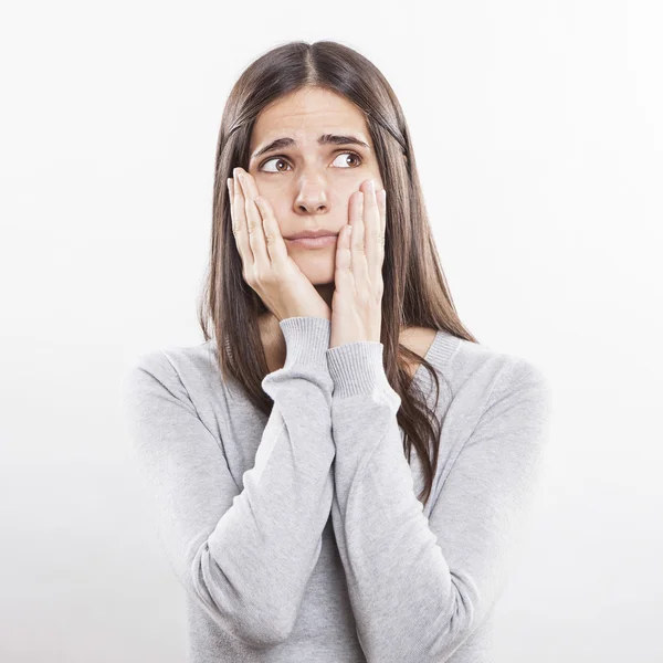 Young beautiful woman worried face expression — Stock Photo, Image